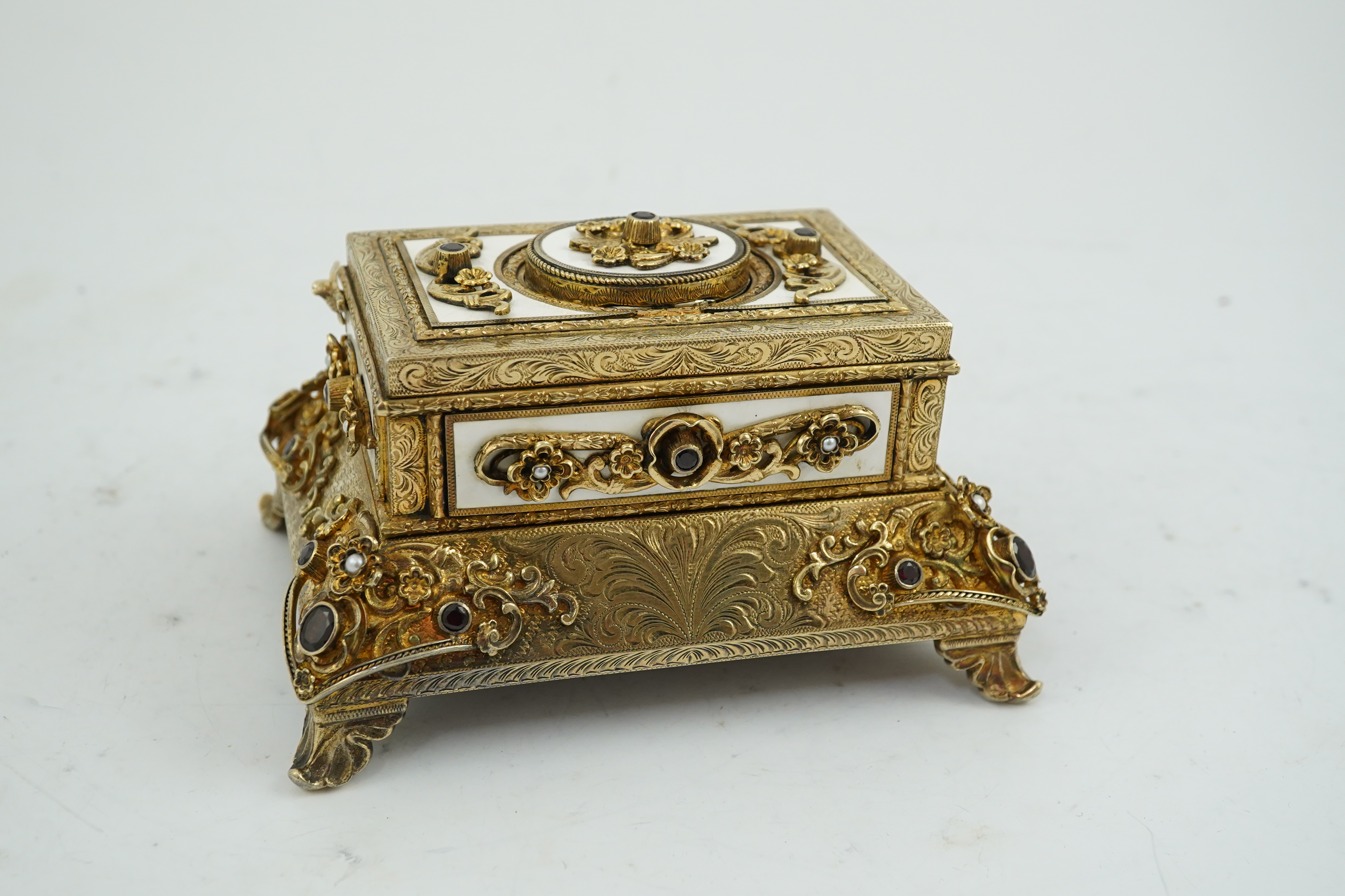 A late Karl Griesbaum Model 17 silver gilt, white enamel, garnet and cultured pearl set automaton singing bird box